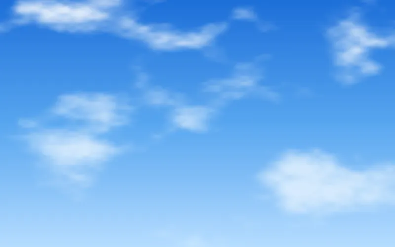 A bright blue midday sky with scattered white clouds.